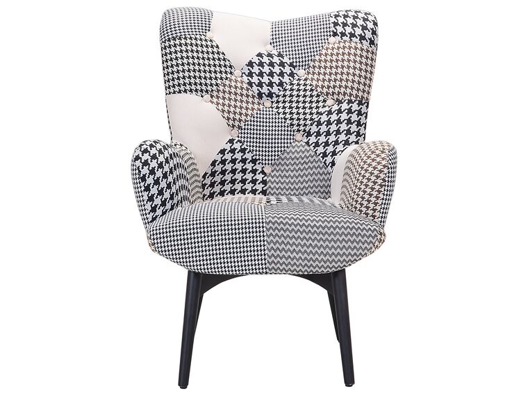 Sillón tapizado con reposapiés